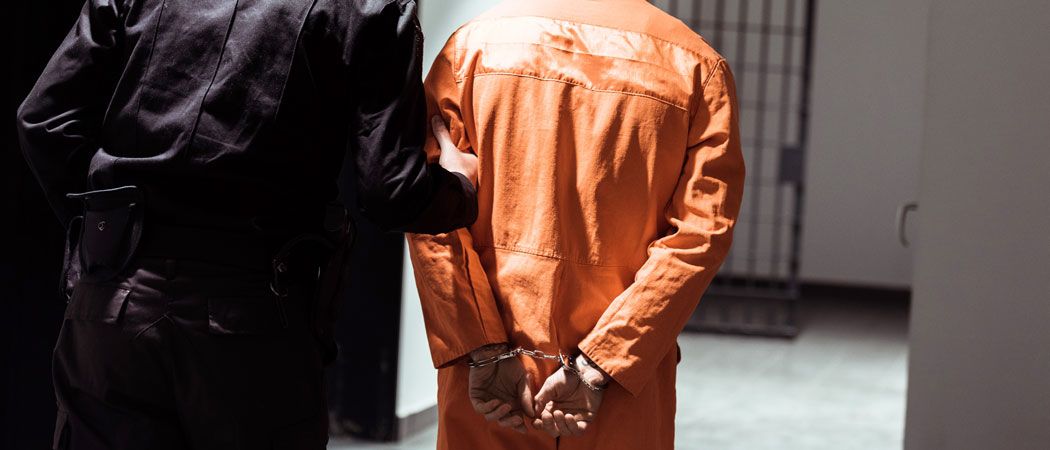 A prisoner and a prison guard
