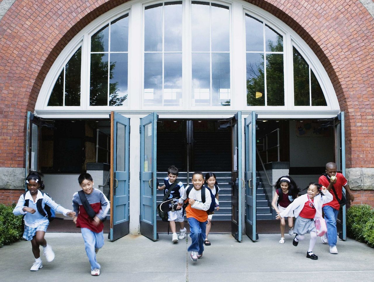 Children running out of the school door