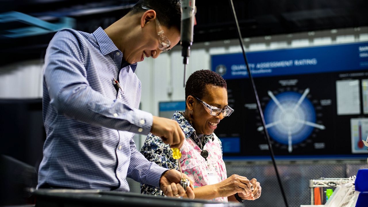 A couple of employees laughing
