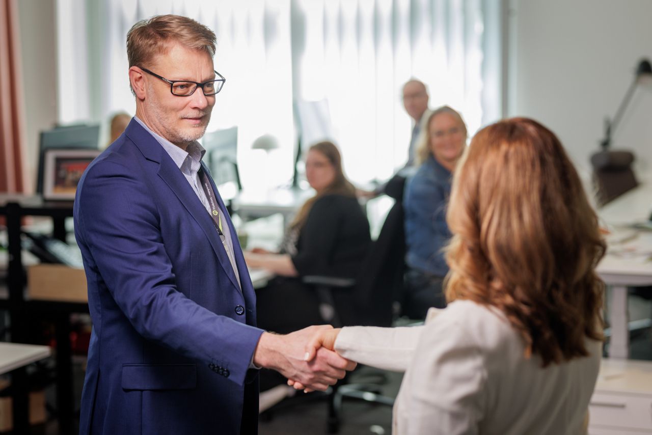 9Solutions Staff shaking hands