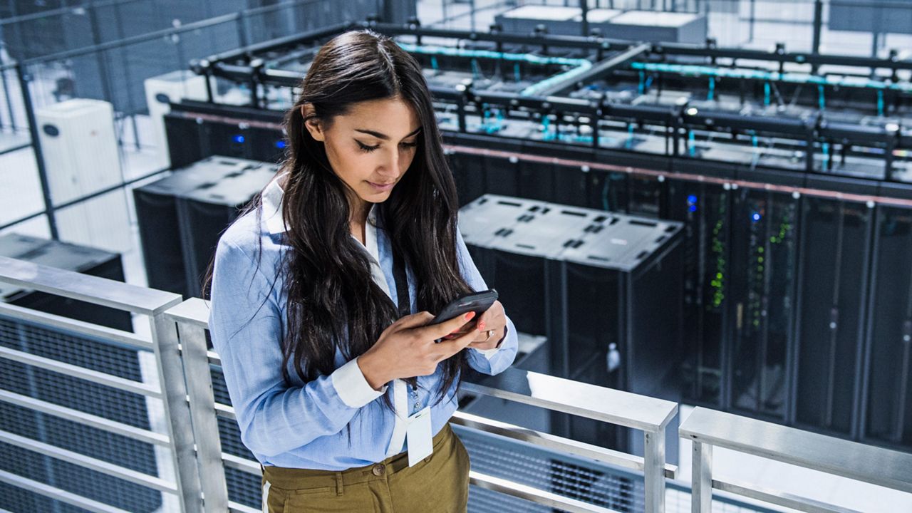 A woman utilizing digital technology at work