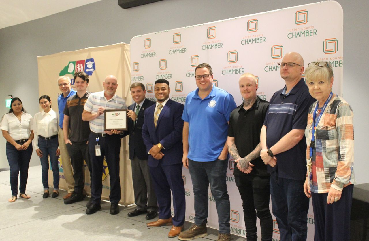 Members of the Record USA production team accept their safety awards from the NC Department of Labor