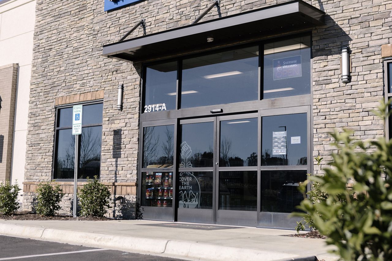 An automatic sliding door on the exterior of a retail building.