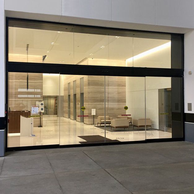 5200 Series all glass sliding door from the exterior of a building