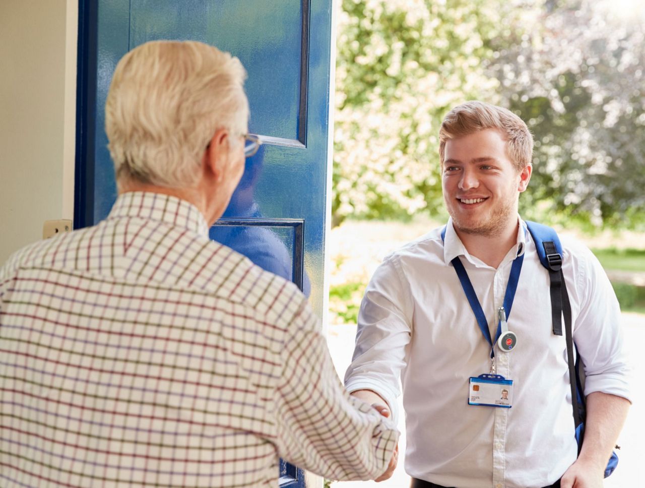 Lone worker meeting and old man at his door