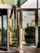 Glass entrance with a Besam revolving door.
