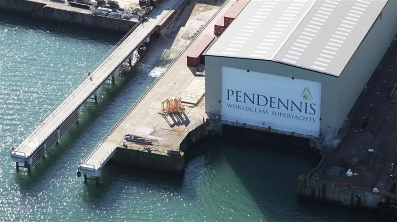 Overview of the Pendennis Shipyard by the sea.