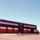 Exterior view of a Sishen mine building. A big red building with red doors.