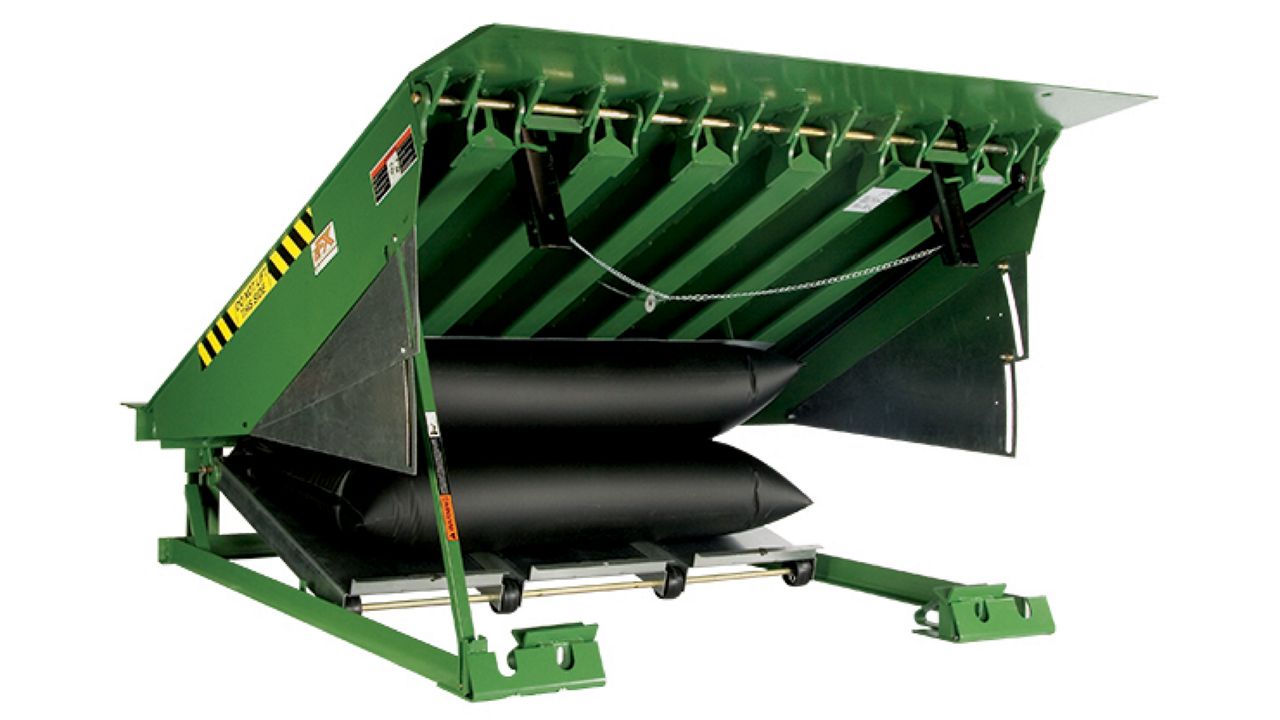 Left view of an economical air-powered pit-style loading dock leveler. 