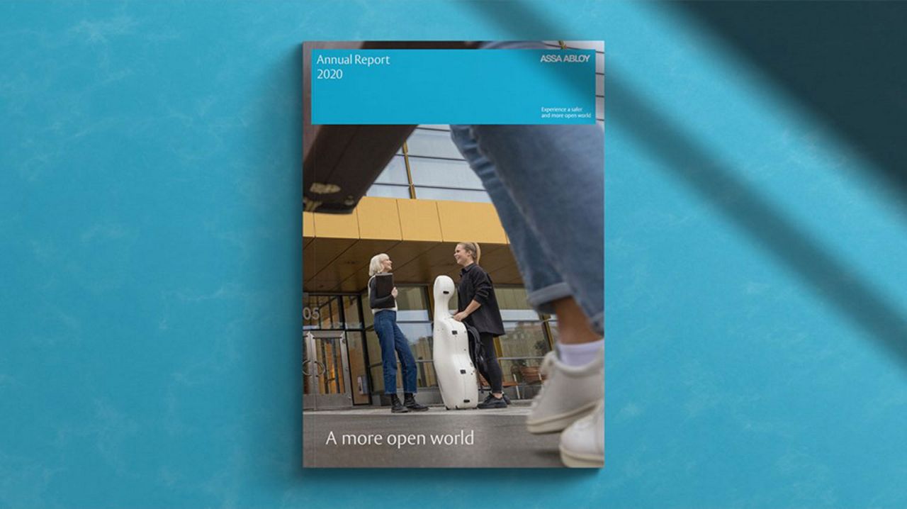 People on the cover of Annual report talking.