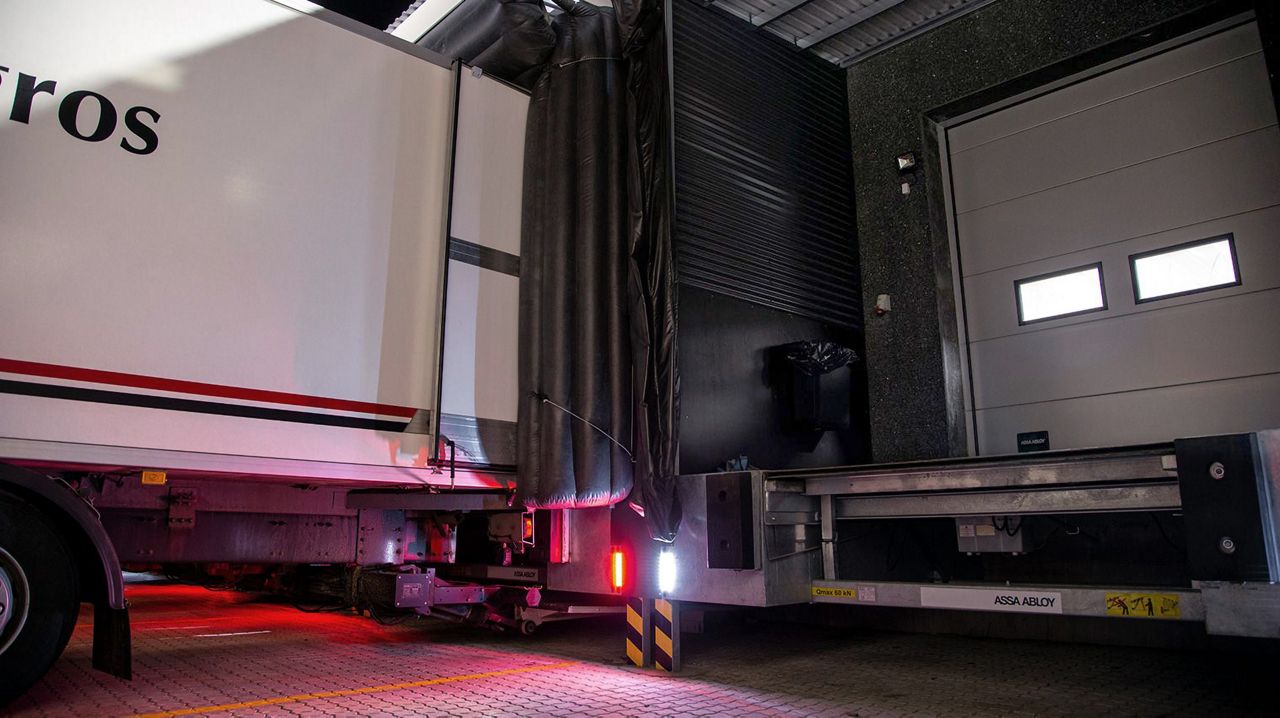 Image: A loading dock in the evening with one truck. 