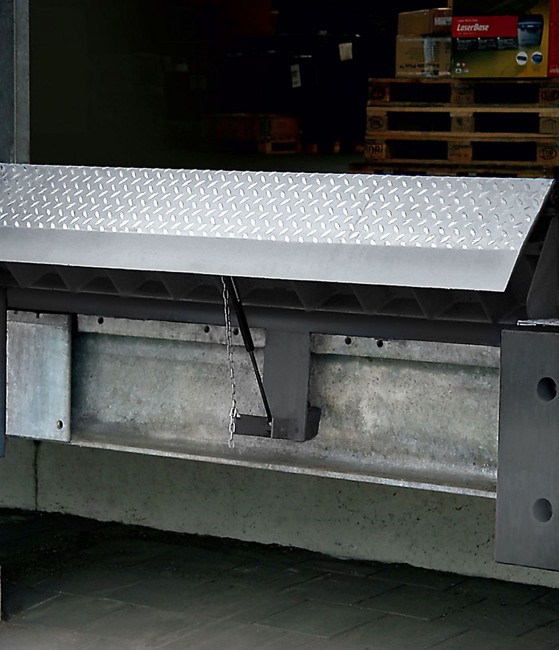 Image: Installation of a blue swingdock minidock leveler. 