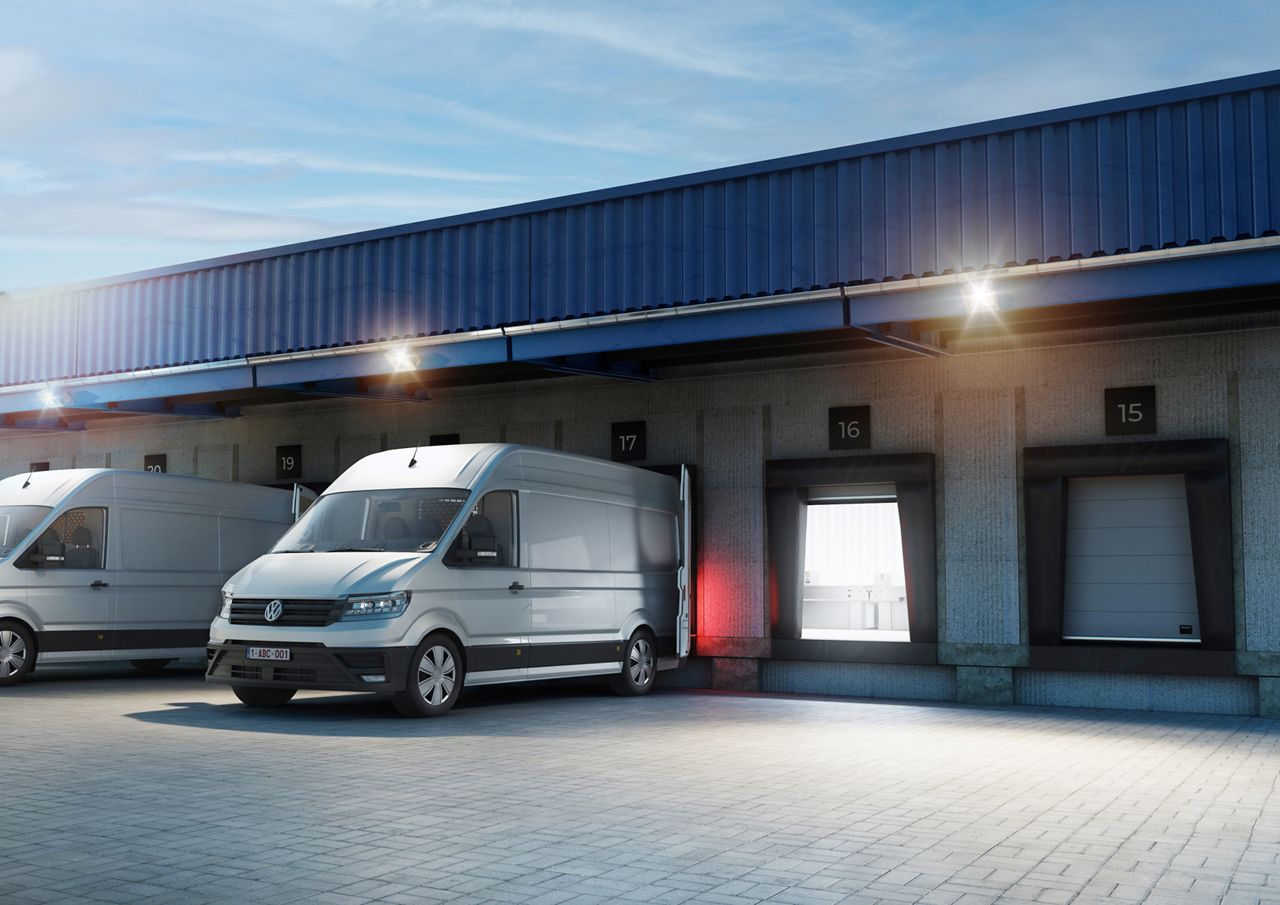 A van has backed into the loadinghouse with the van cushion shelters wrapping around the van