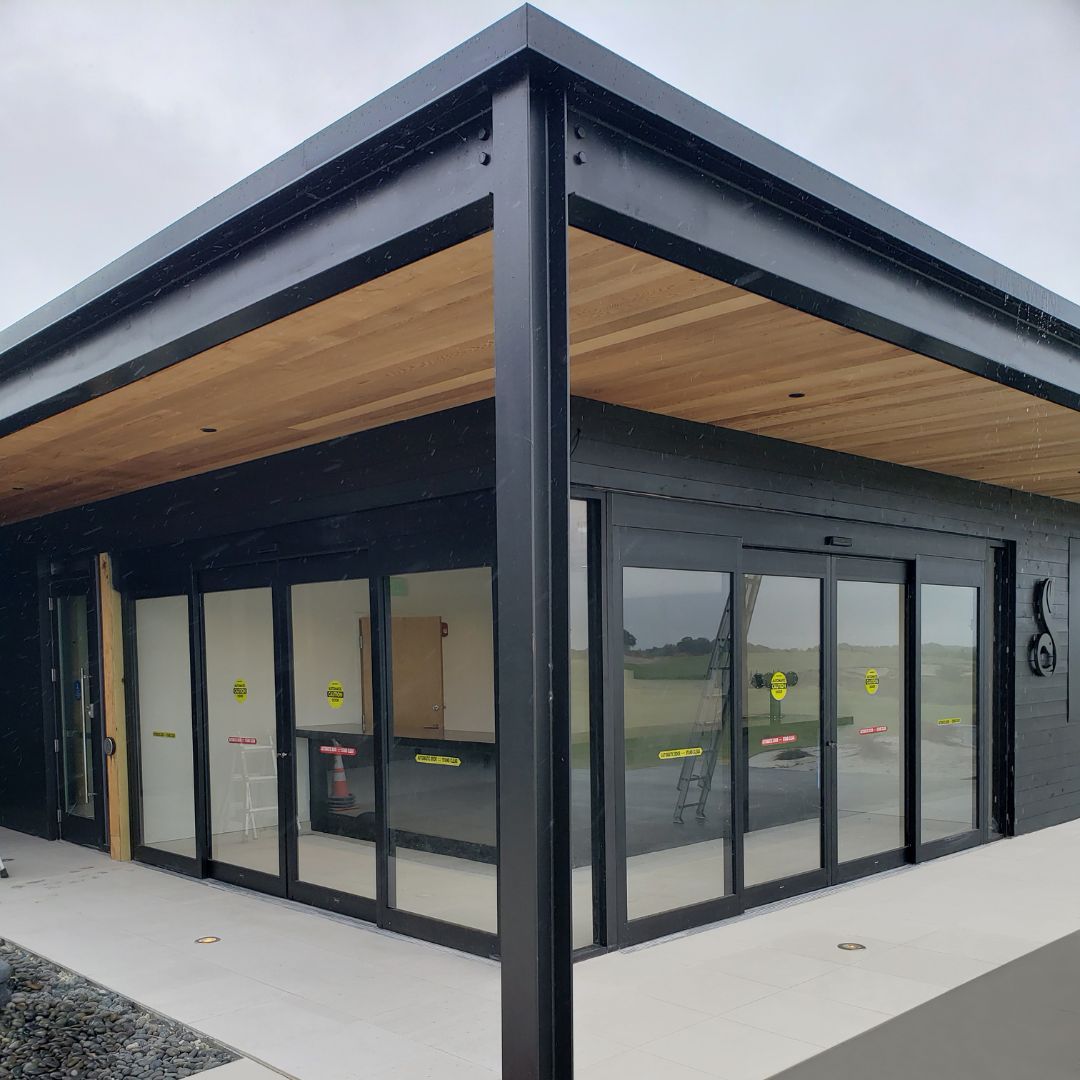 Two black sliding ASSA ABLOY doors