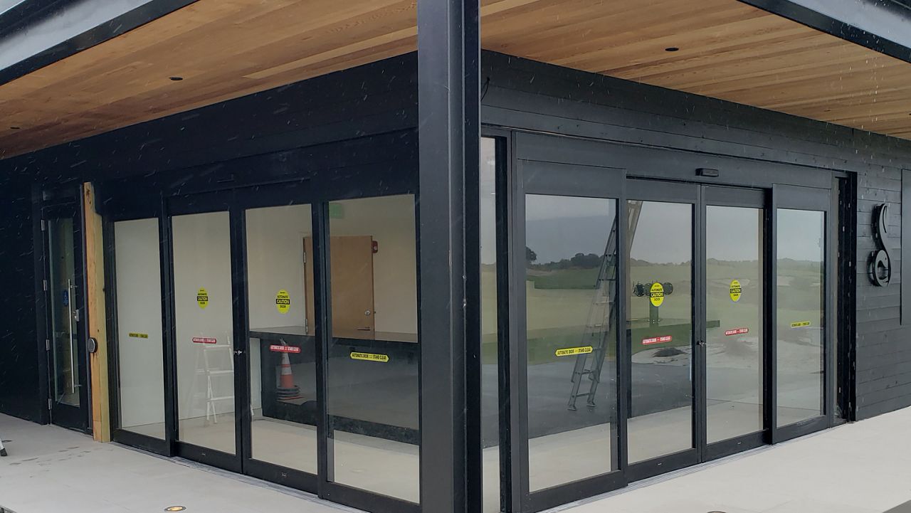 Two black sliding ASSA ABLOY doors