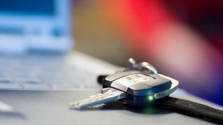 CLIQ® Remore key on a table.