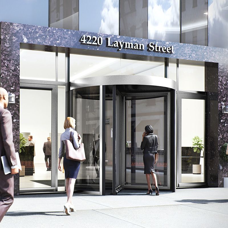 Illustration of people walking in to a building with the ASSA ABLOY RD150 Automatic Revolving Door.