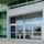 Outside view of a building with the ASSA ABLOY SL500 overhead concealed automatic sliding door.