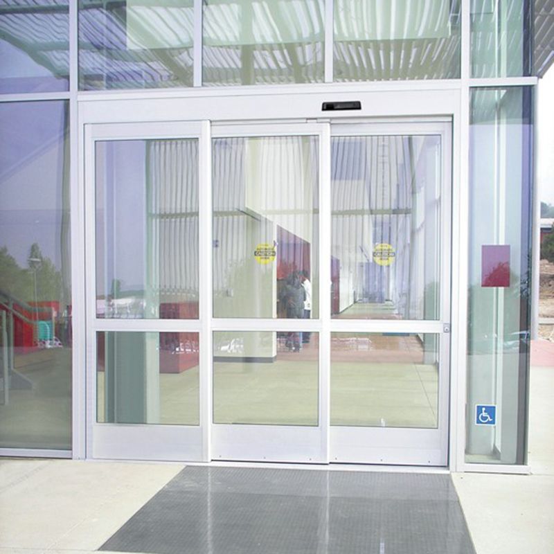 Front View of ASSA ABLOY SL500 Telescopic Door in a Public Building with Glass Walls