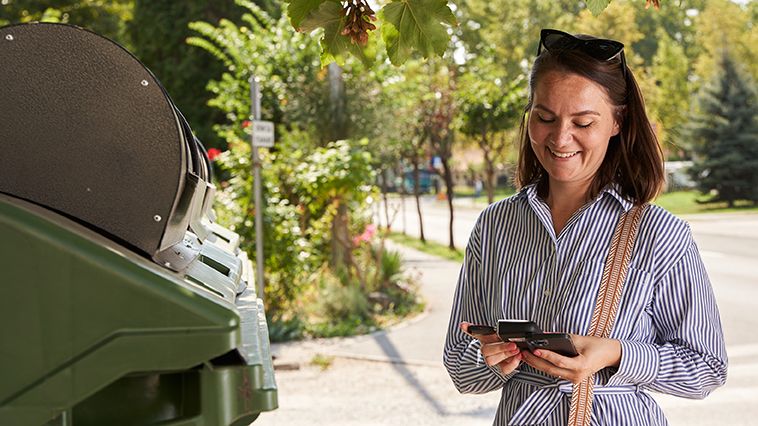 Woman managing locks solution using her mobile phone.