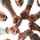 group of employees in a circle fist bumping
