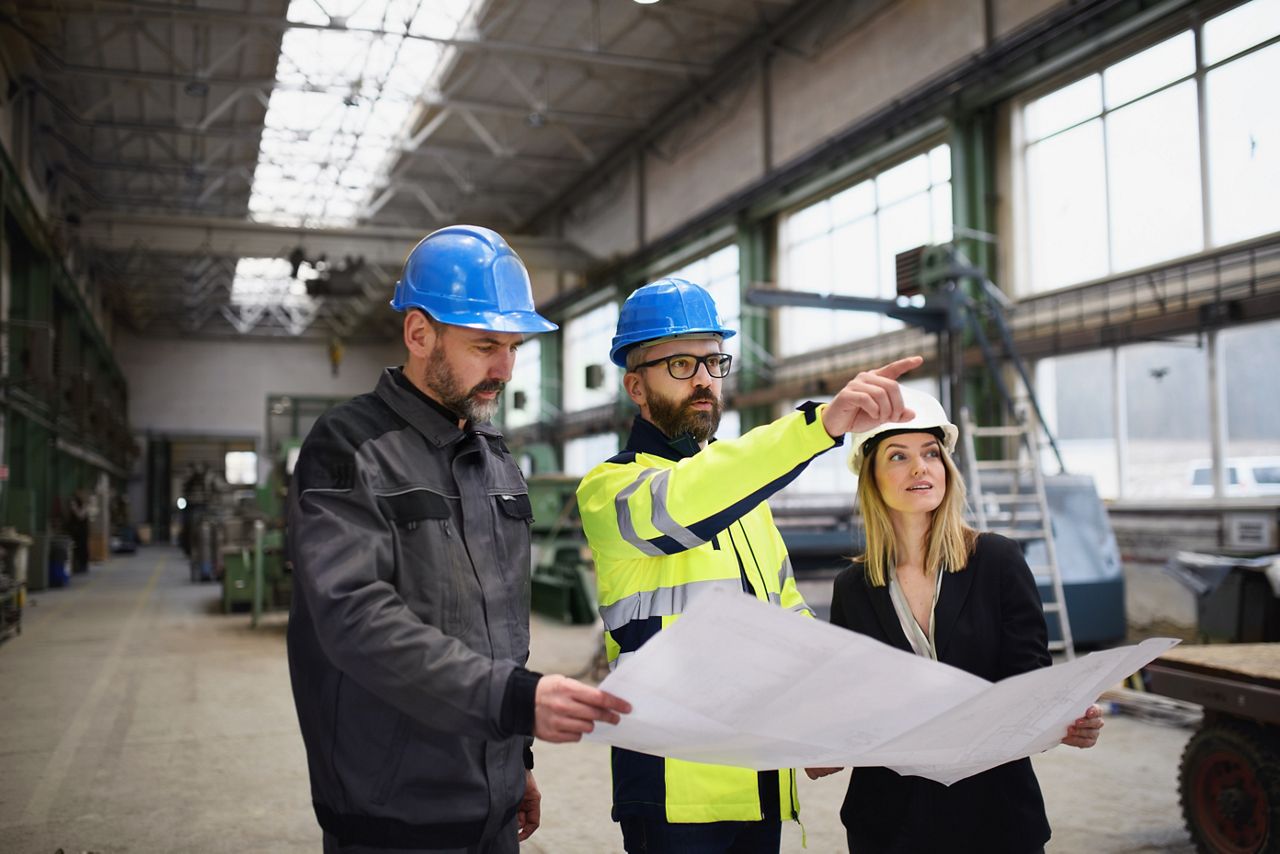 architects reviewing a blueprint