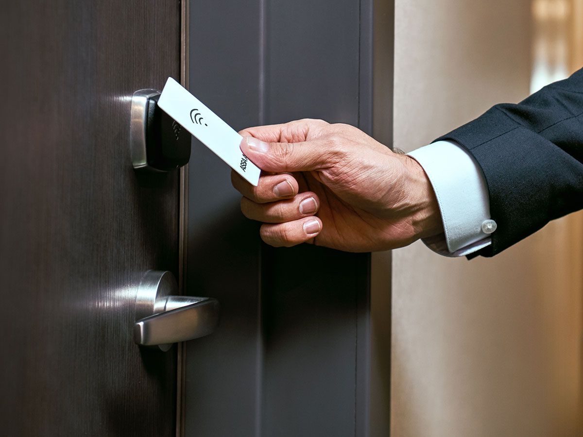 Man opening door with access card