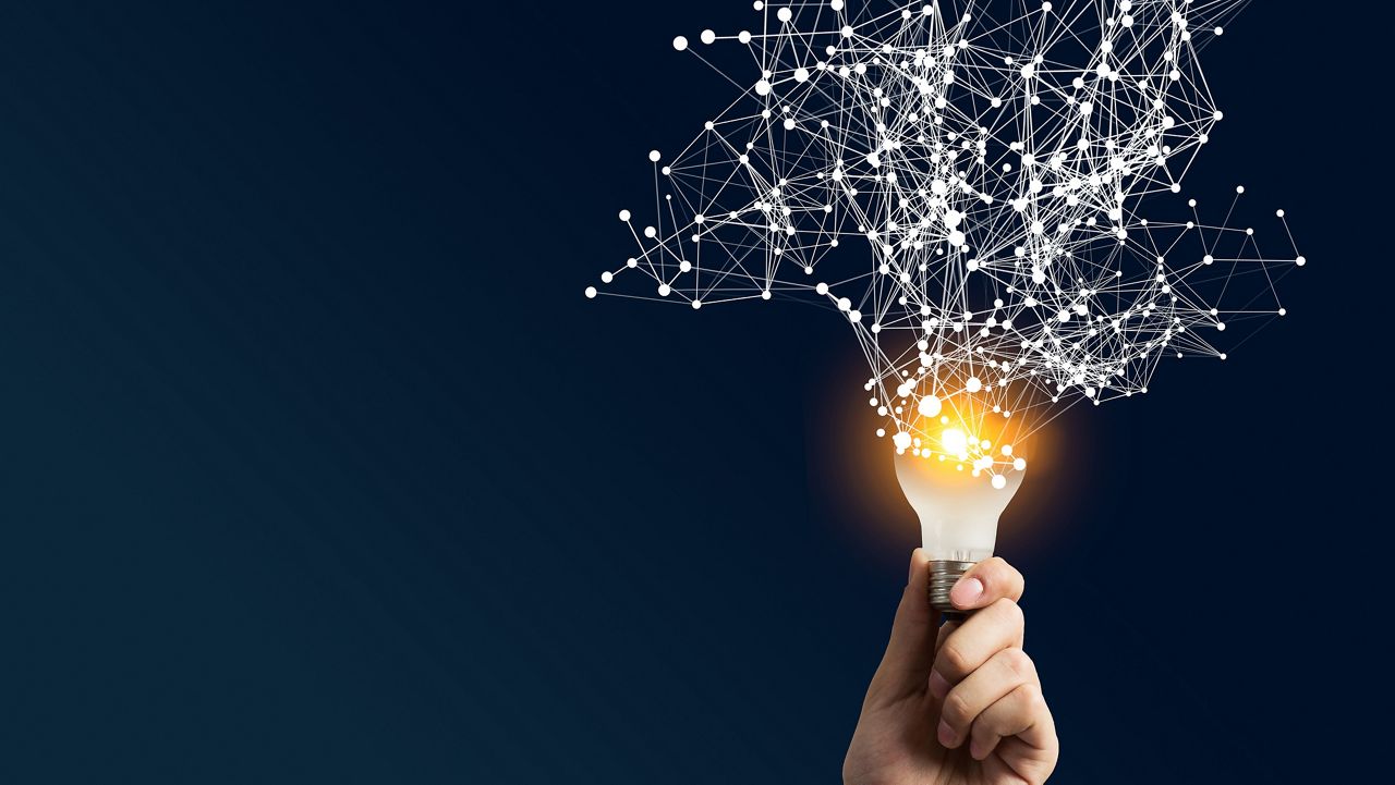 Light bulb with fractal lines spreading from the top