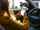 Closeup driver hand is holding smartphone with white screen