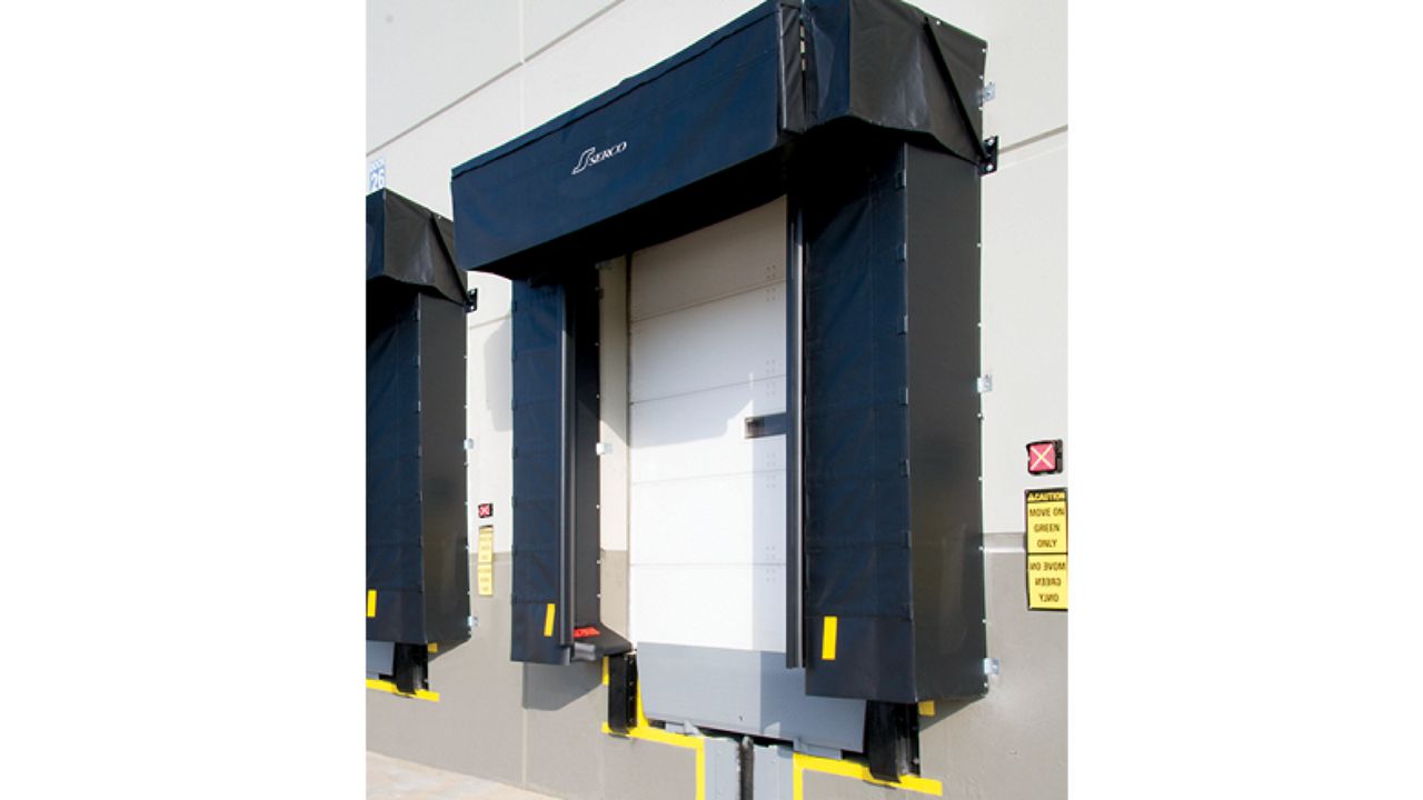 A white door with a black dock shelter.