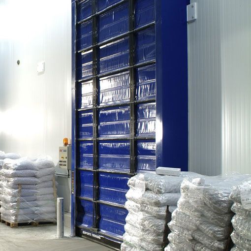 A blue tall shiny door with packages next to the door. 