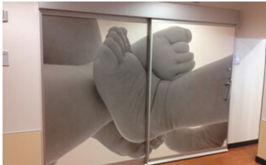 Baby's feet graphic on CLEAN Doors