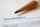 A zoomed in image of a pencil on a piece of paper with the written word "sustainability"