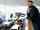 Car dealership manager overlooking the showroom