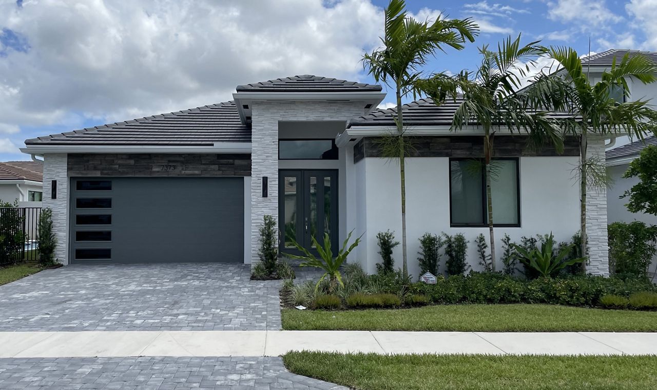 Amarr grey heritage garage door on a modern home in Florida