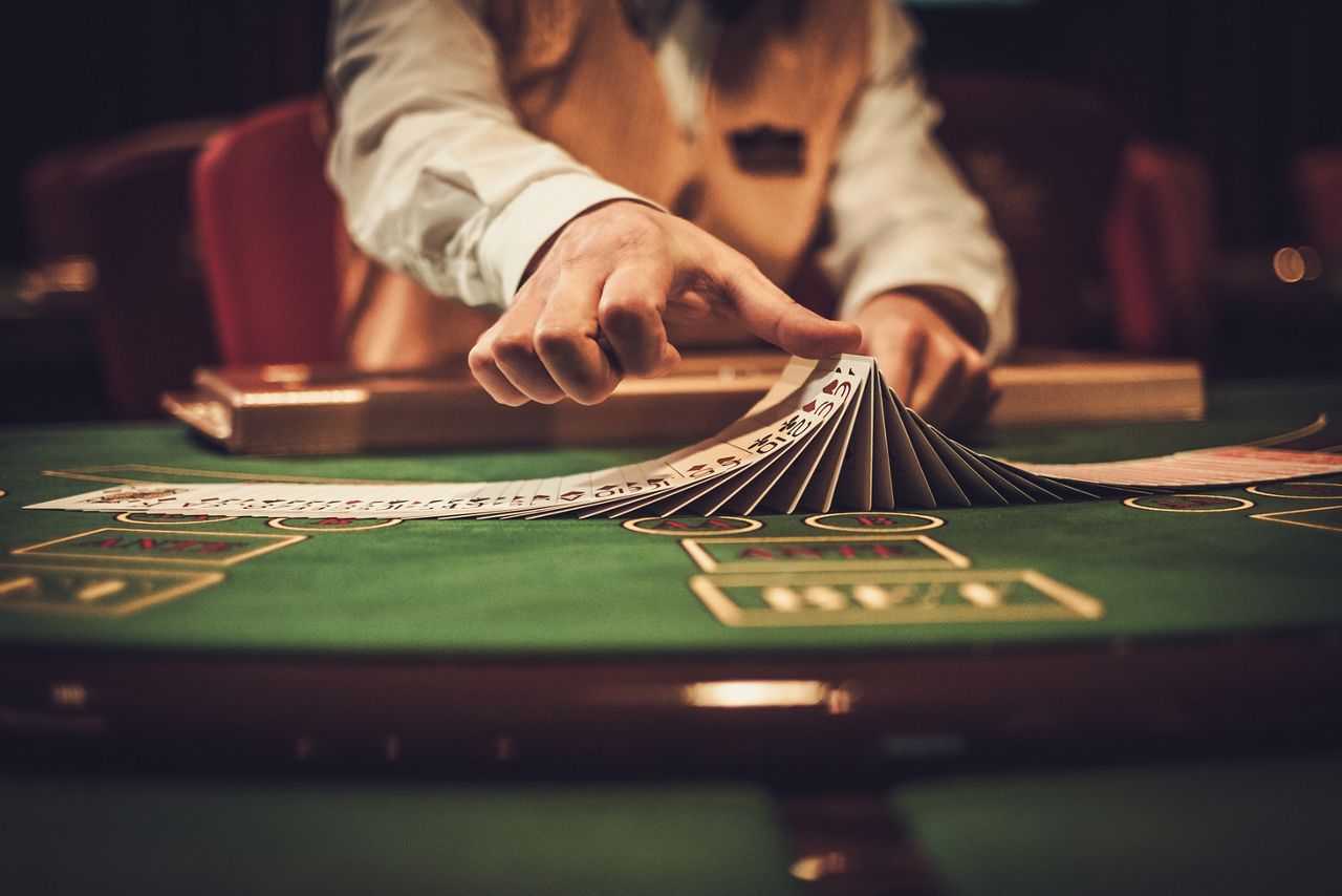 Casino dealer shuffling cards