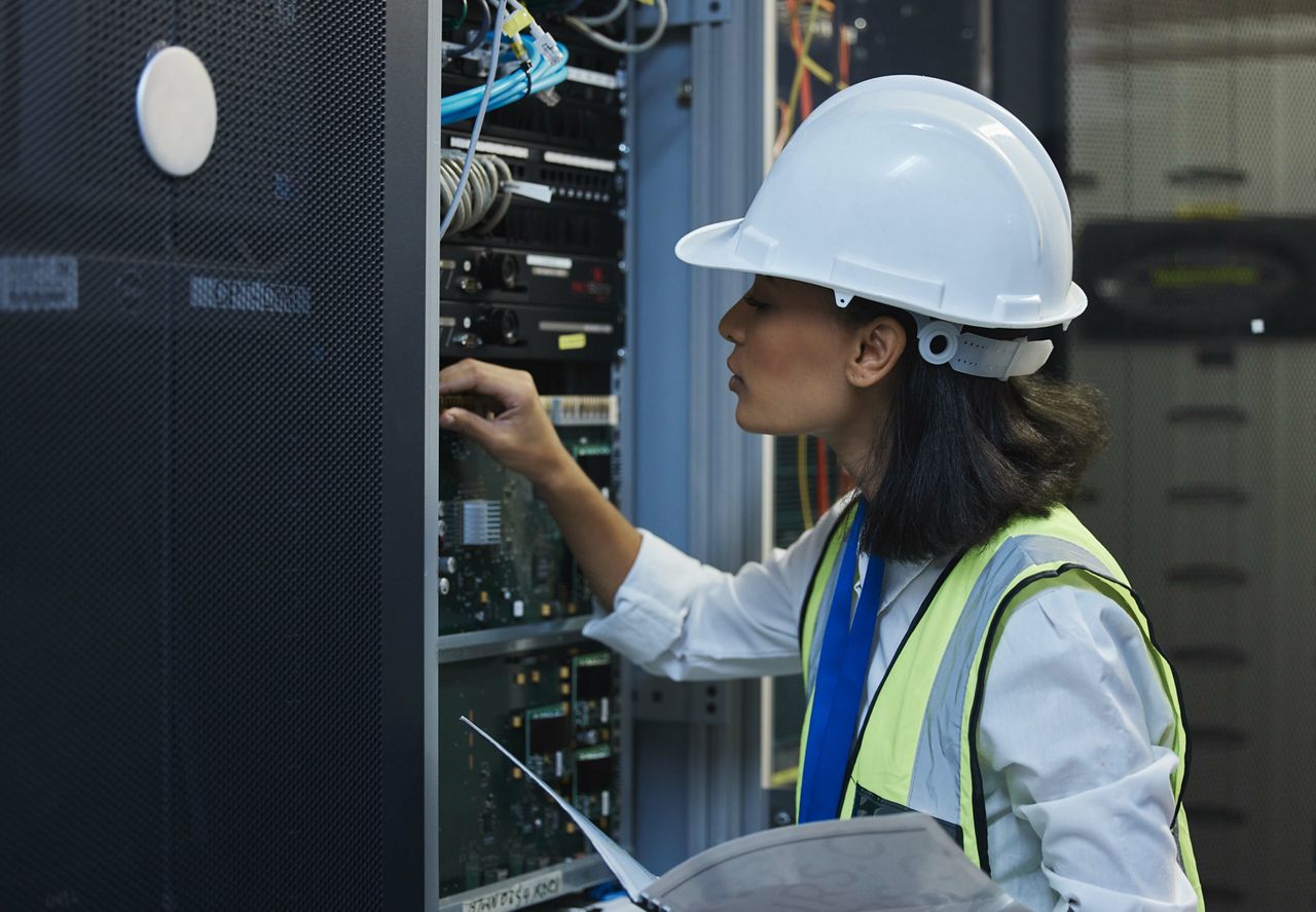 Female engineer in data center