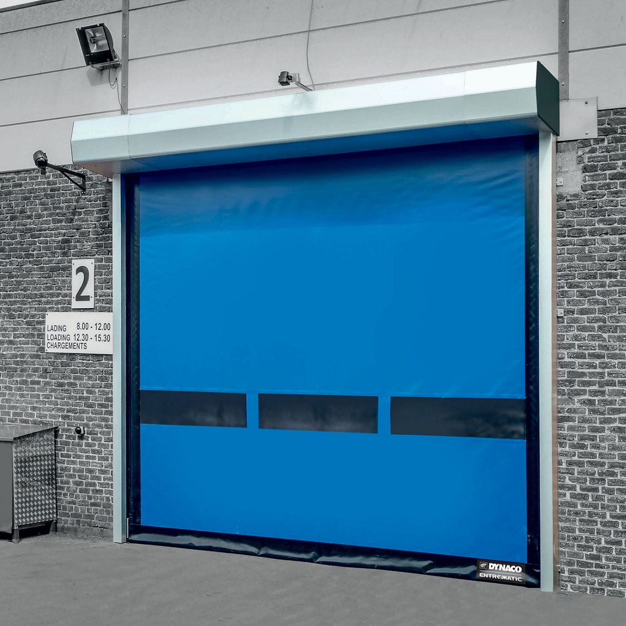 A blue highspeed door installed outside.