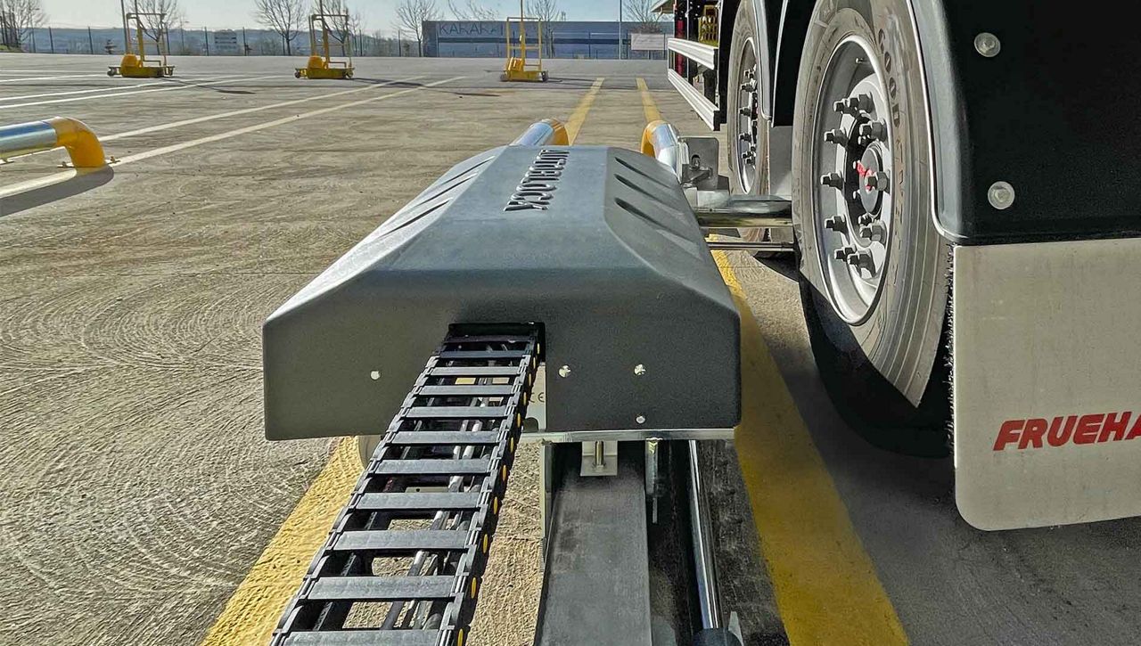 Close-up of a vehicle wheels held in the park position by the DE6290AR automatic wheel restraint system.