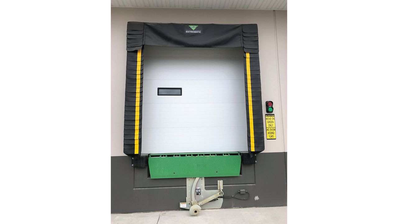  A foam dock seal featuring a hood-style head curtain, ideal for doors 9 feet high or taller, providing a tight seal against various trailer heights installed outside. 