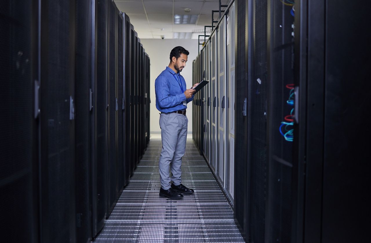 Engineer working in a data center facility