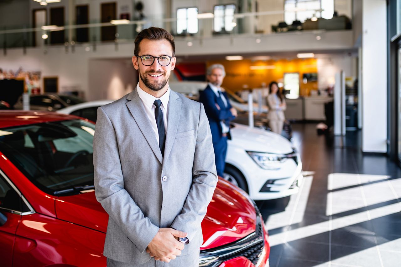 Dealership owner in showroom