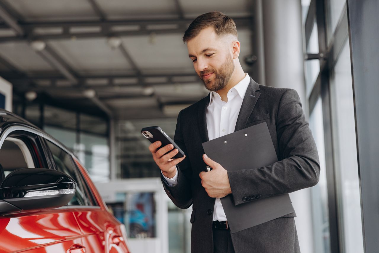Dealership manager monitoring key inventory on a smartphone