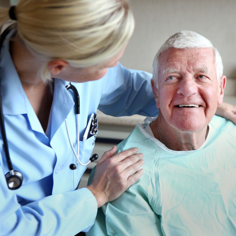 Doctor comforts patient.