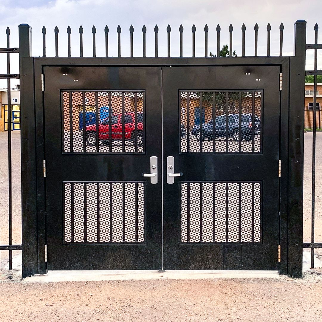 Exodus double swing gate with pickets and infill.