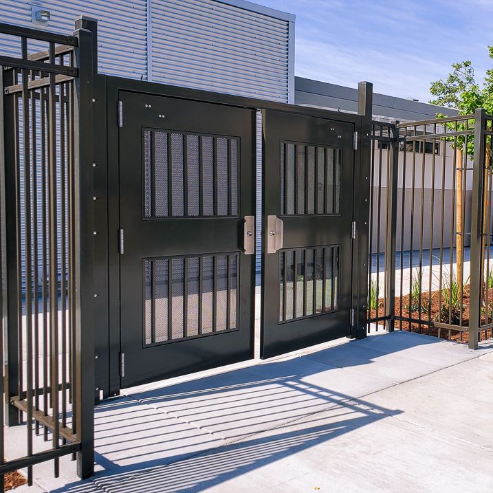Exodus double swing gate with pickets and infill.