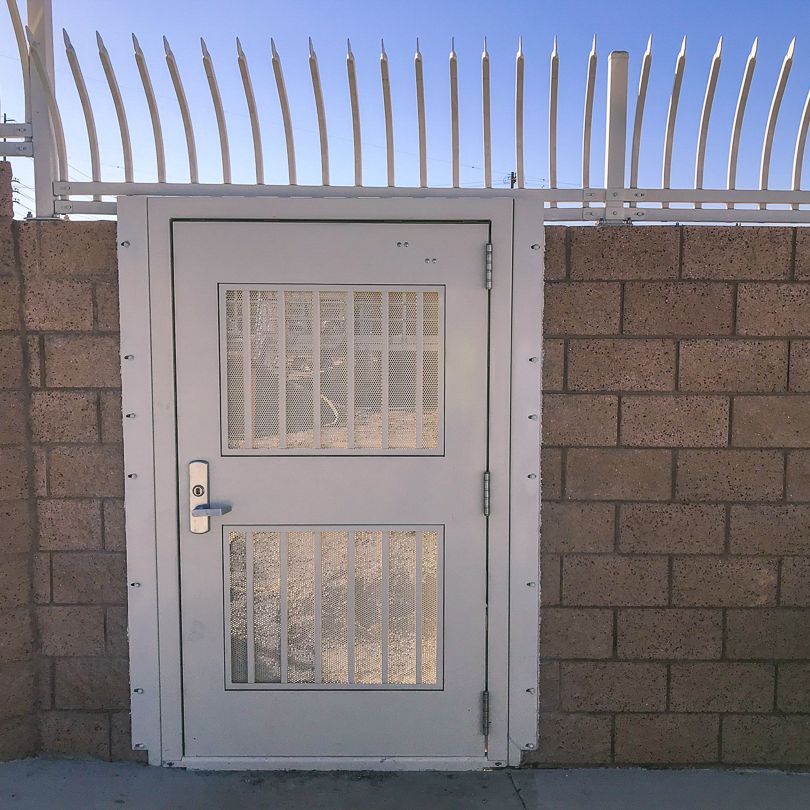 Exodus single swing gate with pickets and infill.