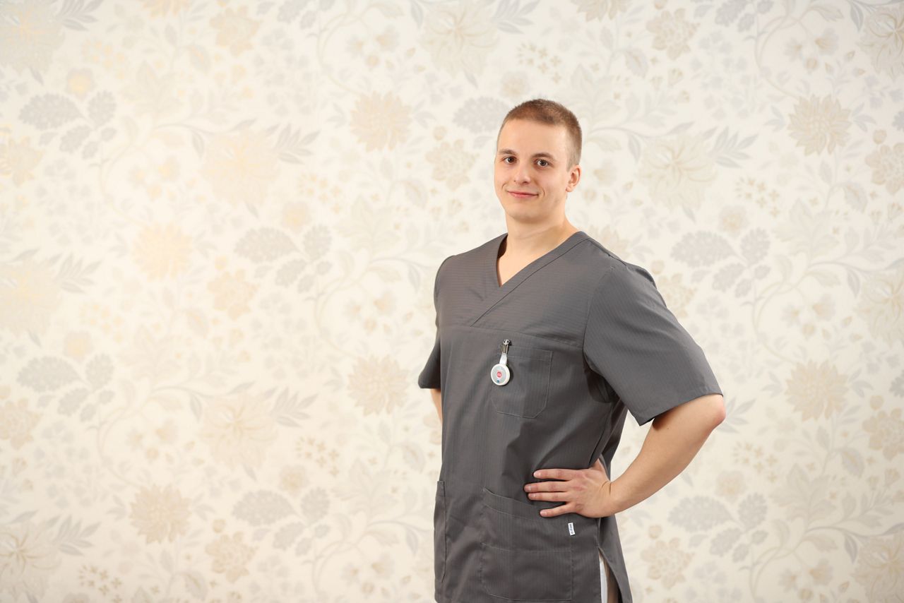 Male nurse posing and smiling for the camera