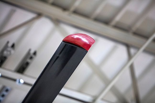 A black fan blade with a red tip