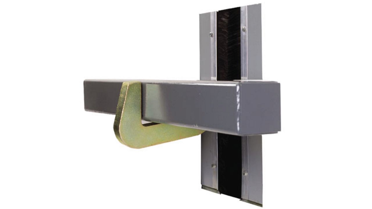 A sleek and compact industrial device with a concealed hook mechanism for secure vehicle anchoring.